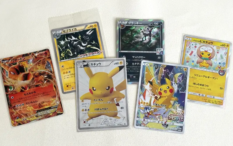 Japanese Pokémon promo card lineup with Pikachu and Charizard